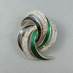White glass, green and black enamel, fancy brooch