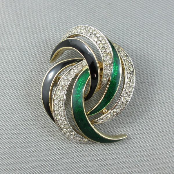 White glass, green and black enamel, fancy brooch