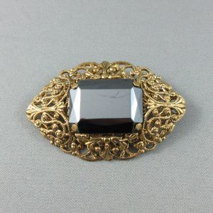 Black glass brooch
