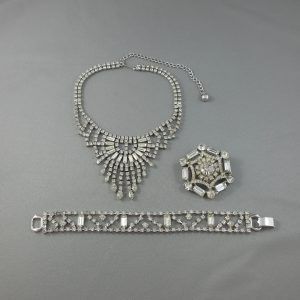 Necklace, bracelet and brooch, white glass